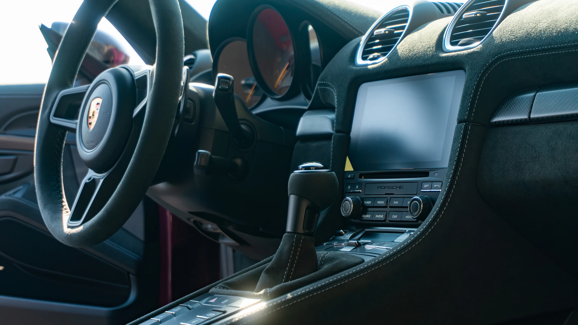 a close up of a steering wheel and dashboard of a car