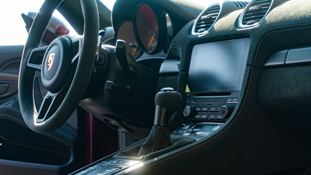 a close up of a steering wheel and dashboard of a car