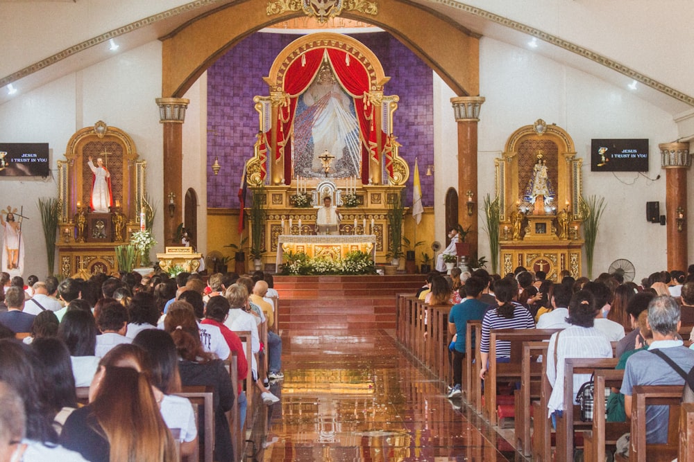 a large group of people sitting in a church