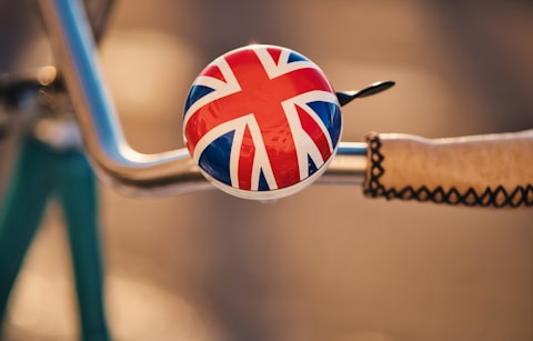a close up of a bike handle with a flag on it