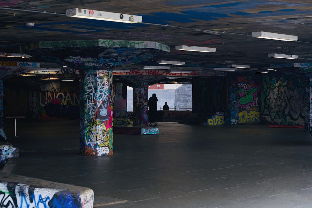 a large room with graffiti all over the walls