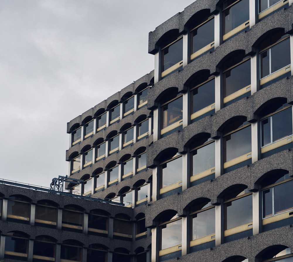 a tall building with lots of windows on top of it