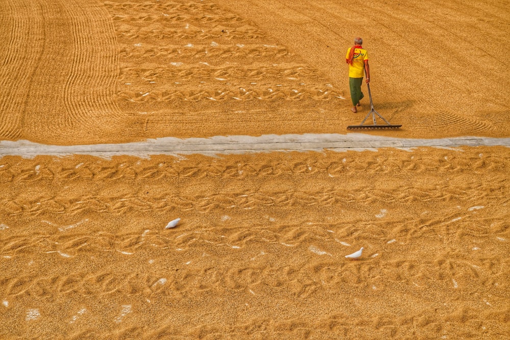 a man is standing in the middle of a field