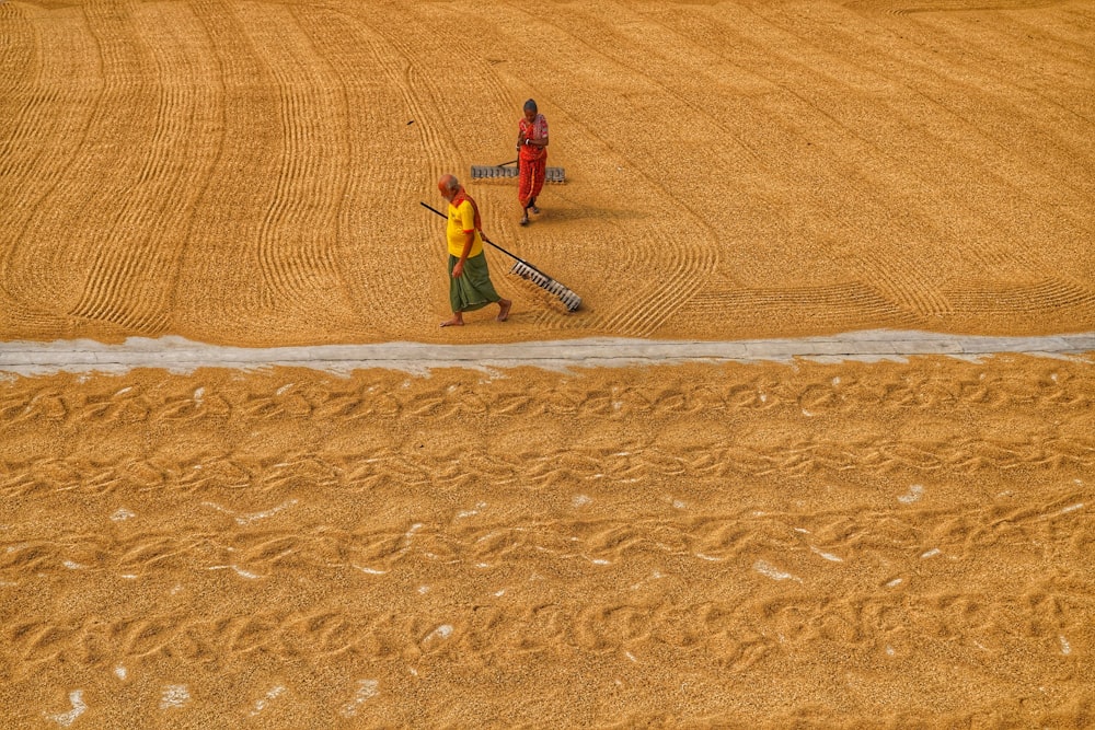 a couple of people that are standing in the dirt