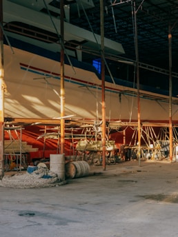 A professional inspector examining a ship's hull during a dry dock supervision.