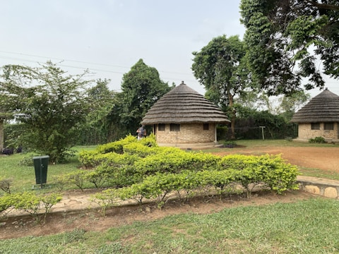 Sheltered housing units surrounded by lush greenery for agricultural workers.