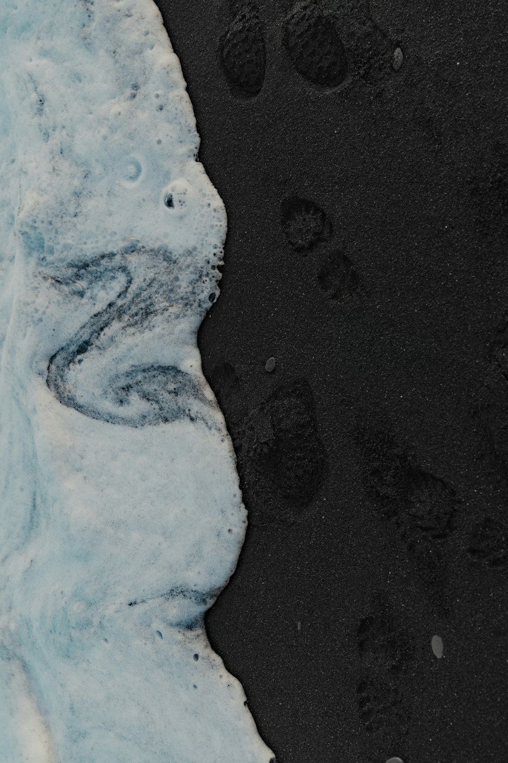 a black and white photo of footprints in the snow