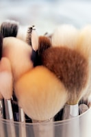 A collection of beauty tools such as brushes and applicators.