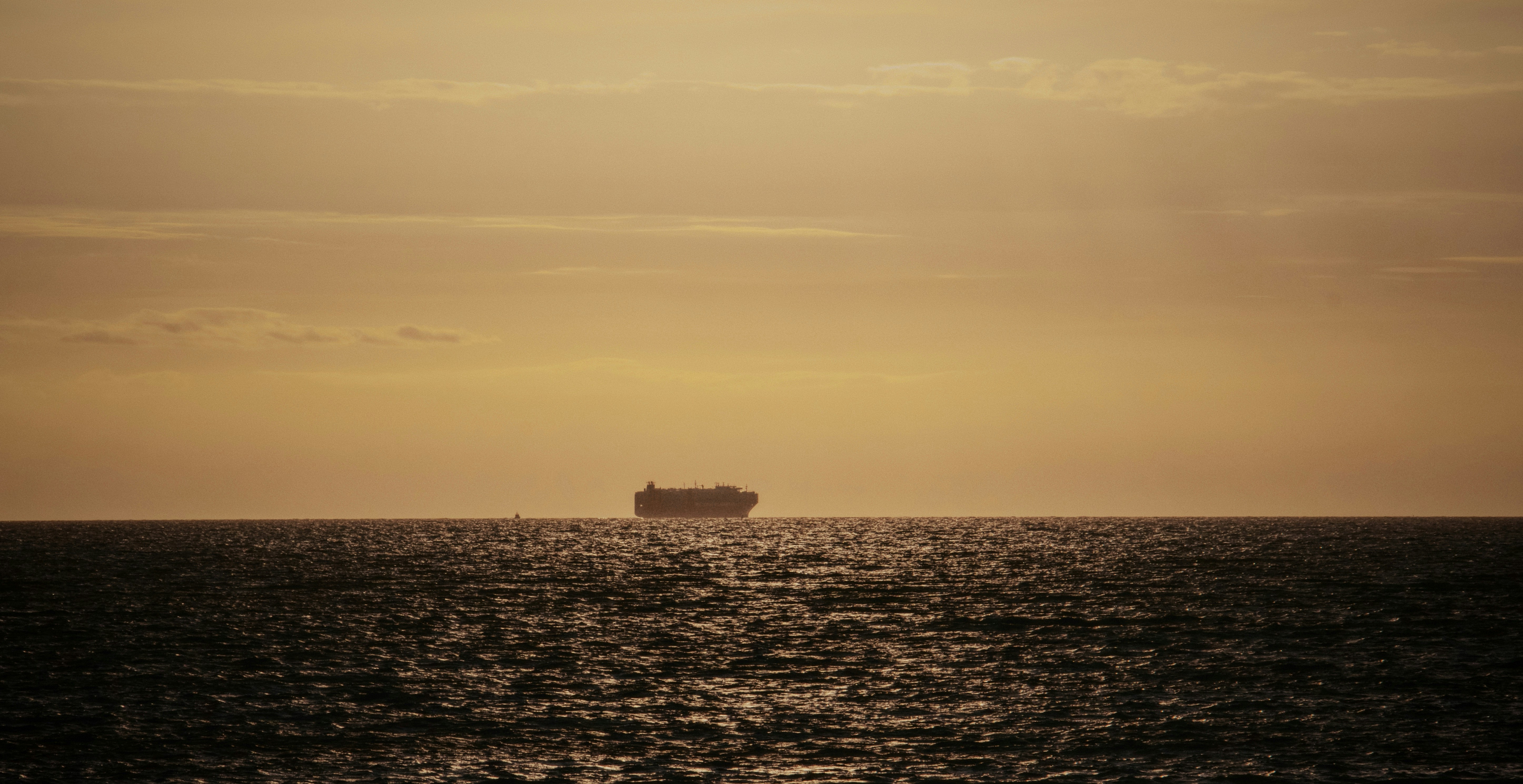 a large ship sailing across a large body of water