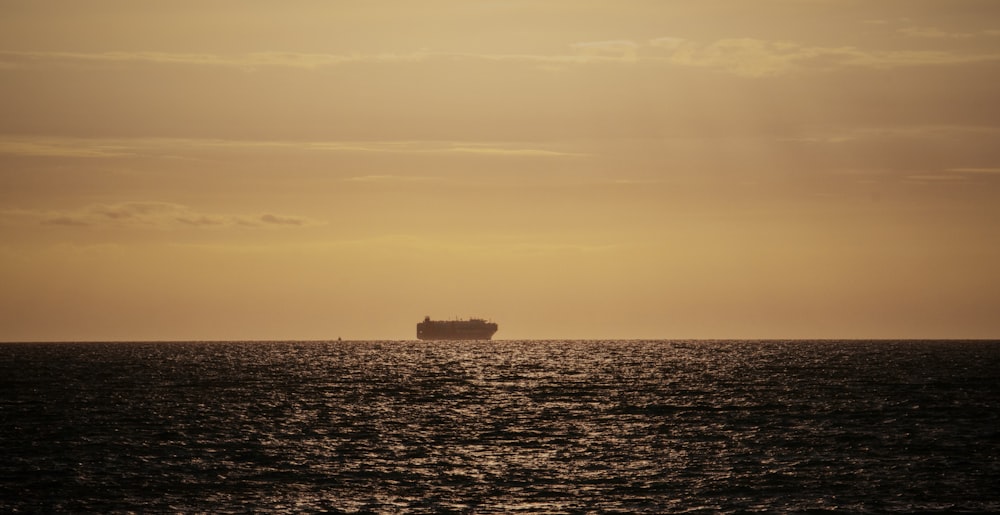 a large ship sailing across a large body of water