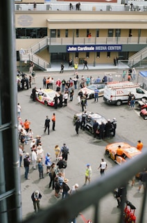 Drivers and teams gathered in the pit area, preparing their cars with focused energy