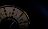 Close-up of a vintage ham radio dial glowing softly in the dark.