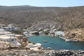 A peaceful harbor dotted with fishing boats and cafes, capturing the essence of Greek island life