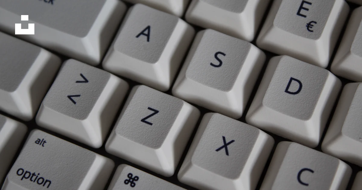 Computer With Keys Missing A close up of a computer keyboard with the keys missing photo – Free ...
