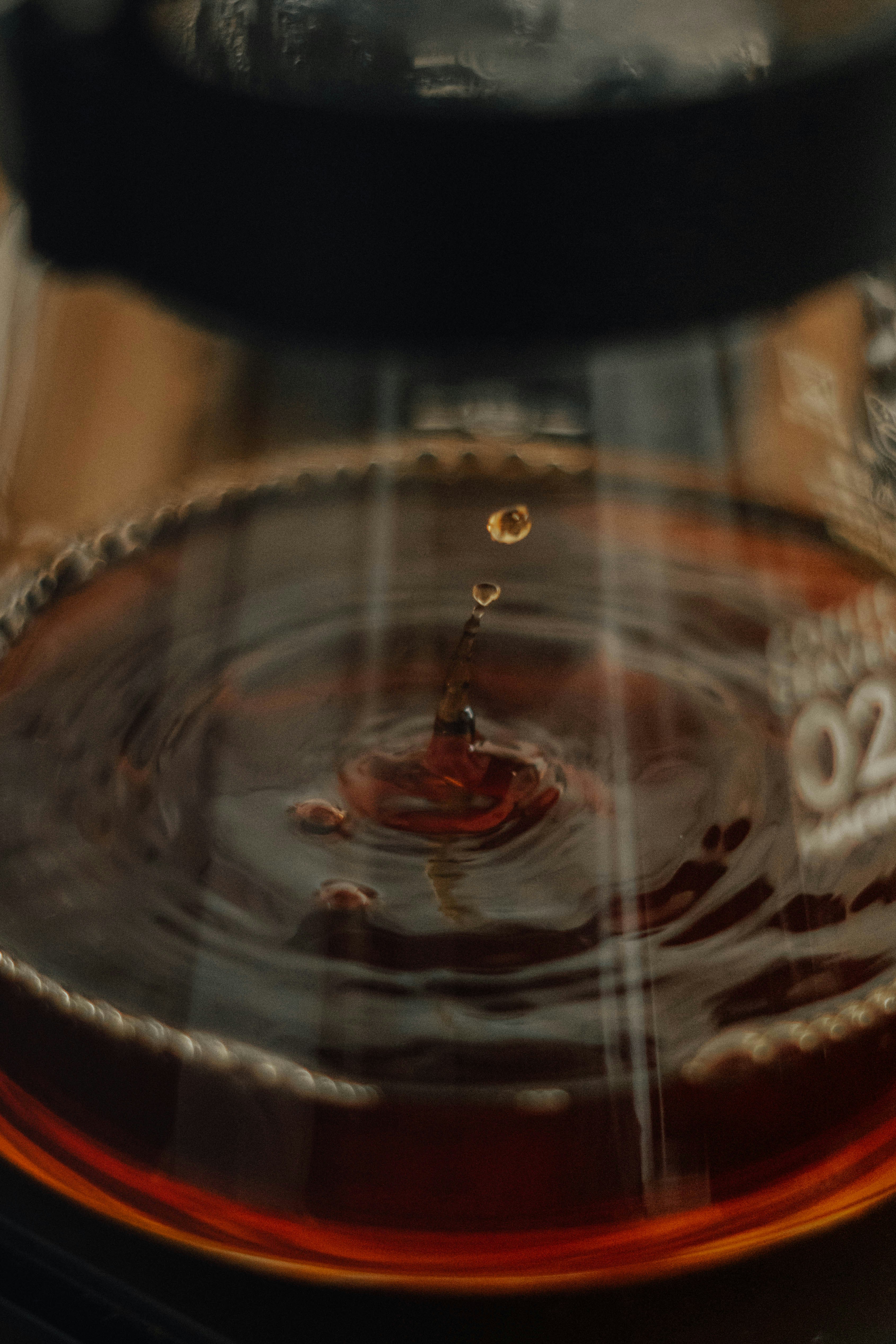 a close up of a water drop on a plate