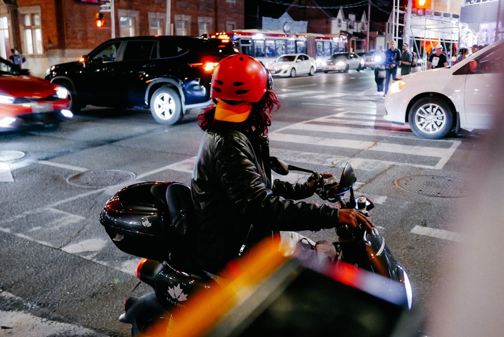 a person riding a motorcycle on a city street