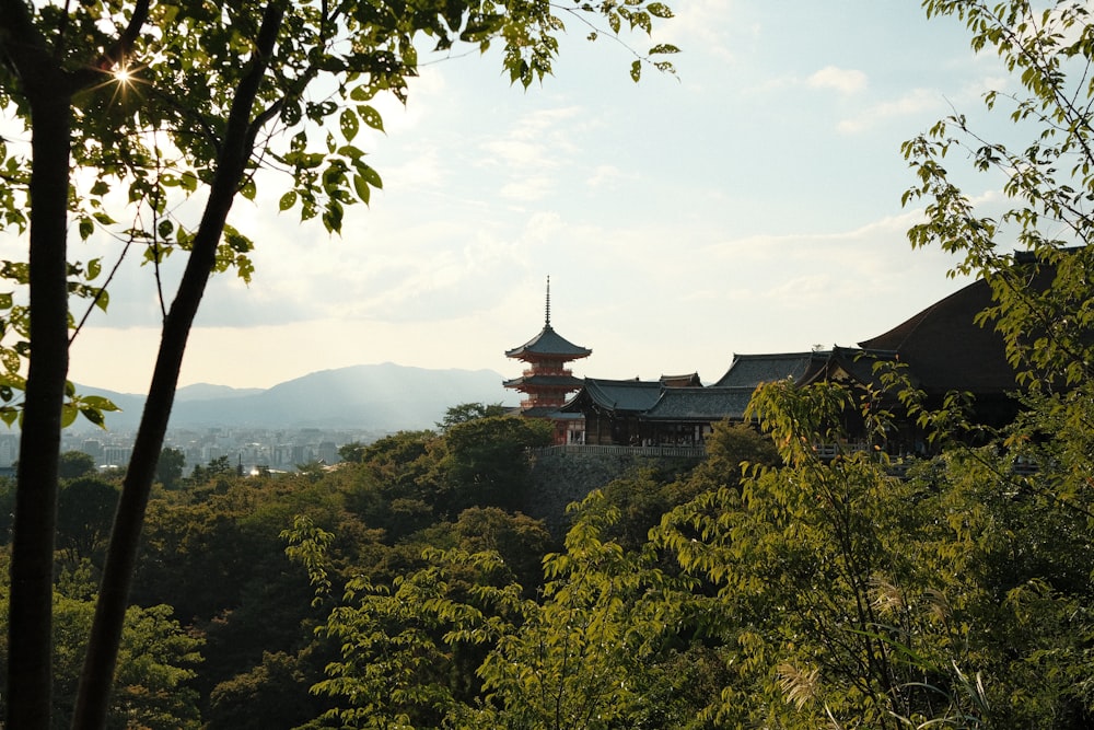 a building on top of a hill surrounded by trees