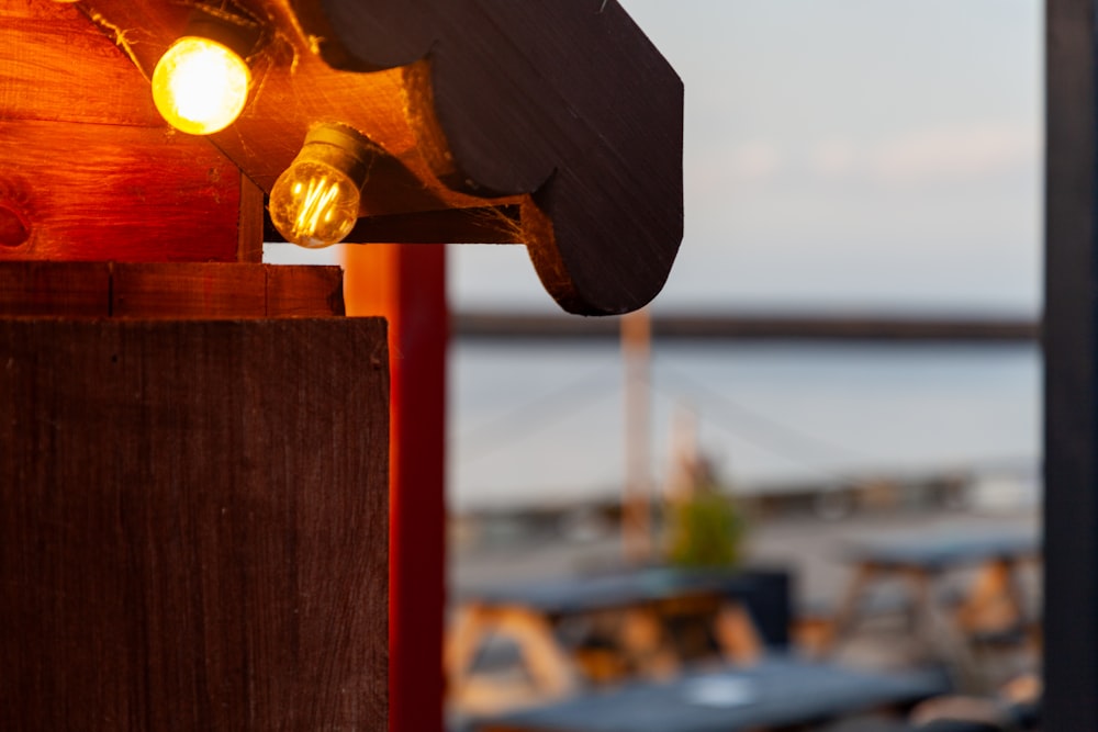 a close up of a light on a wooden pole