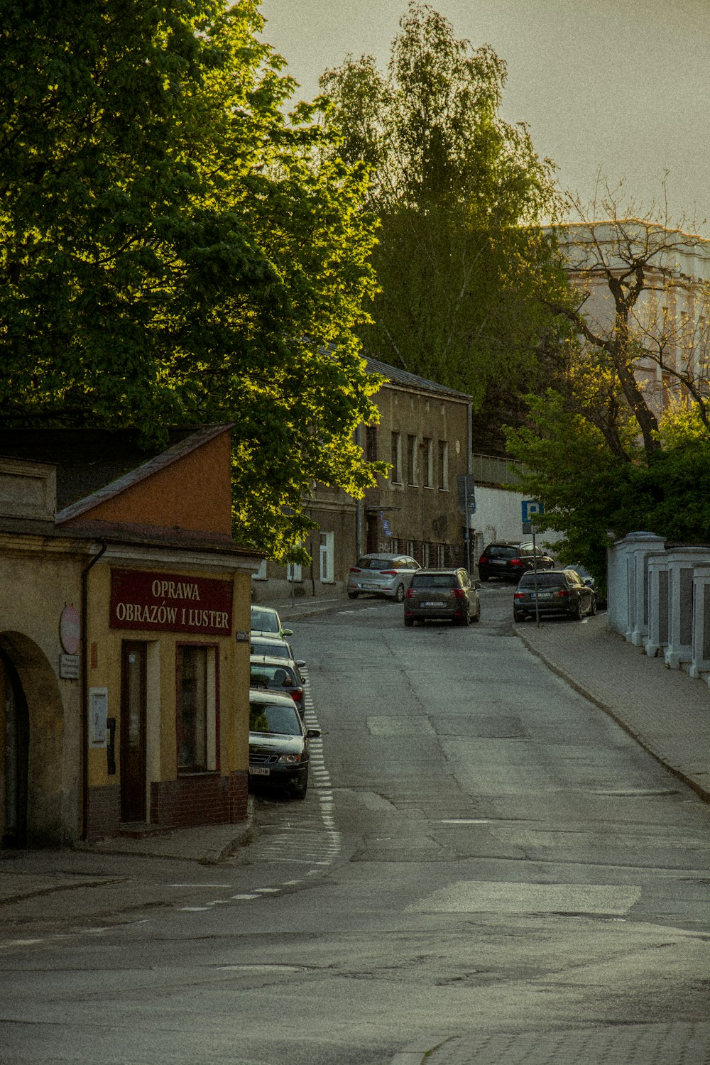 a street with cars parked on both sides of it