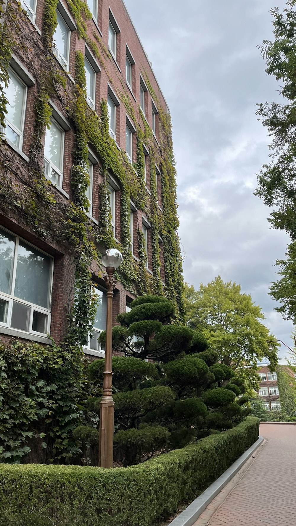 a street light sitting next to a tall building