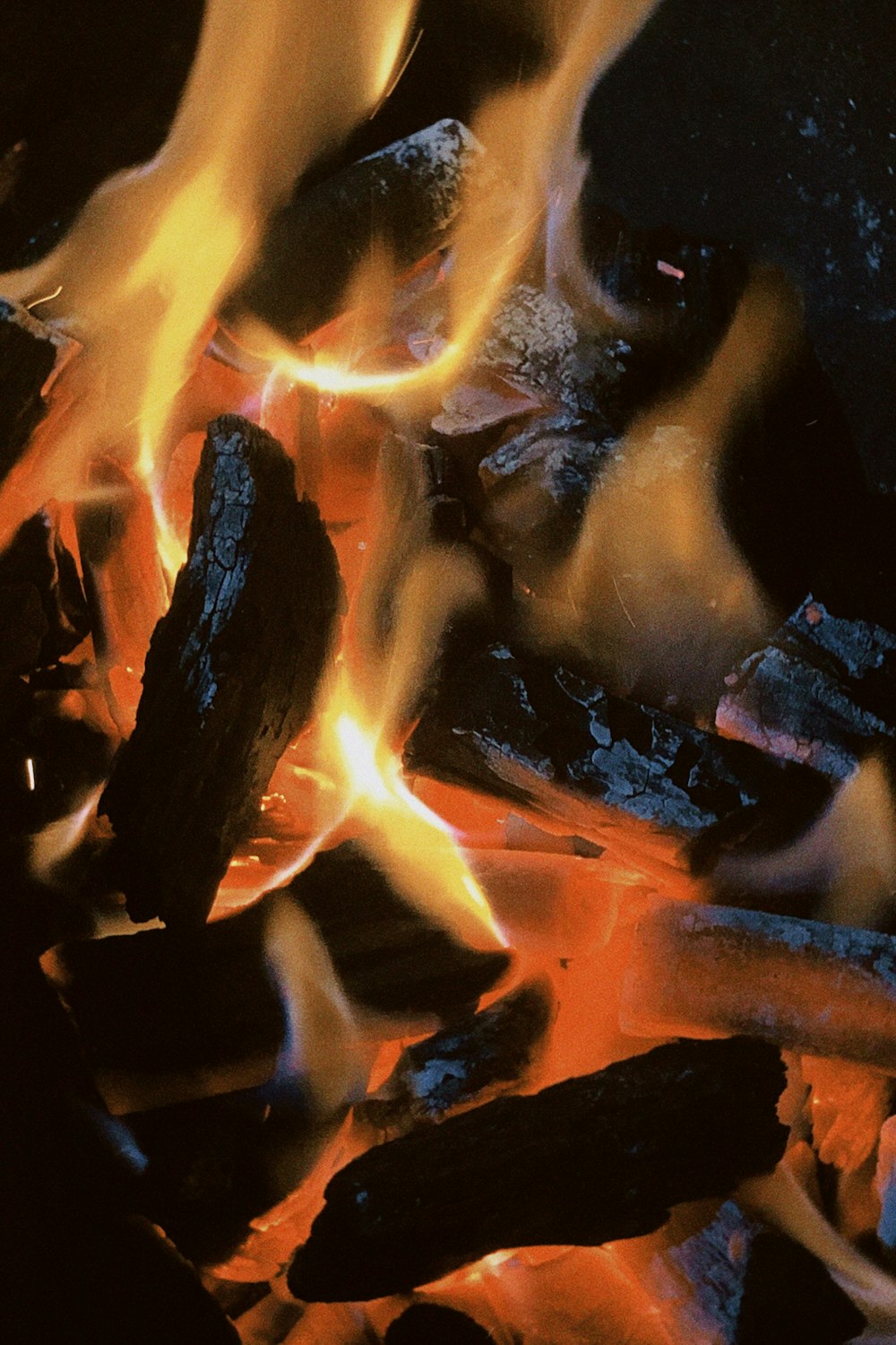 a close up of a fire burning in a fireplace