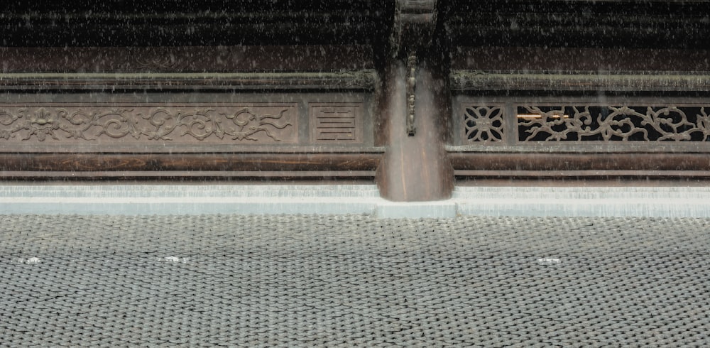 a person with an umbrella walking in the rain