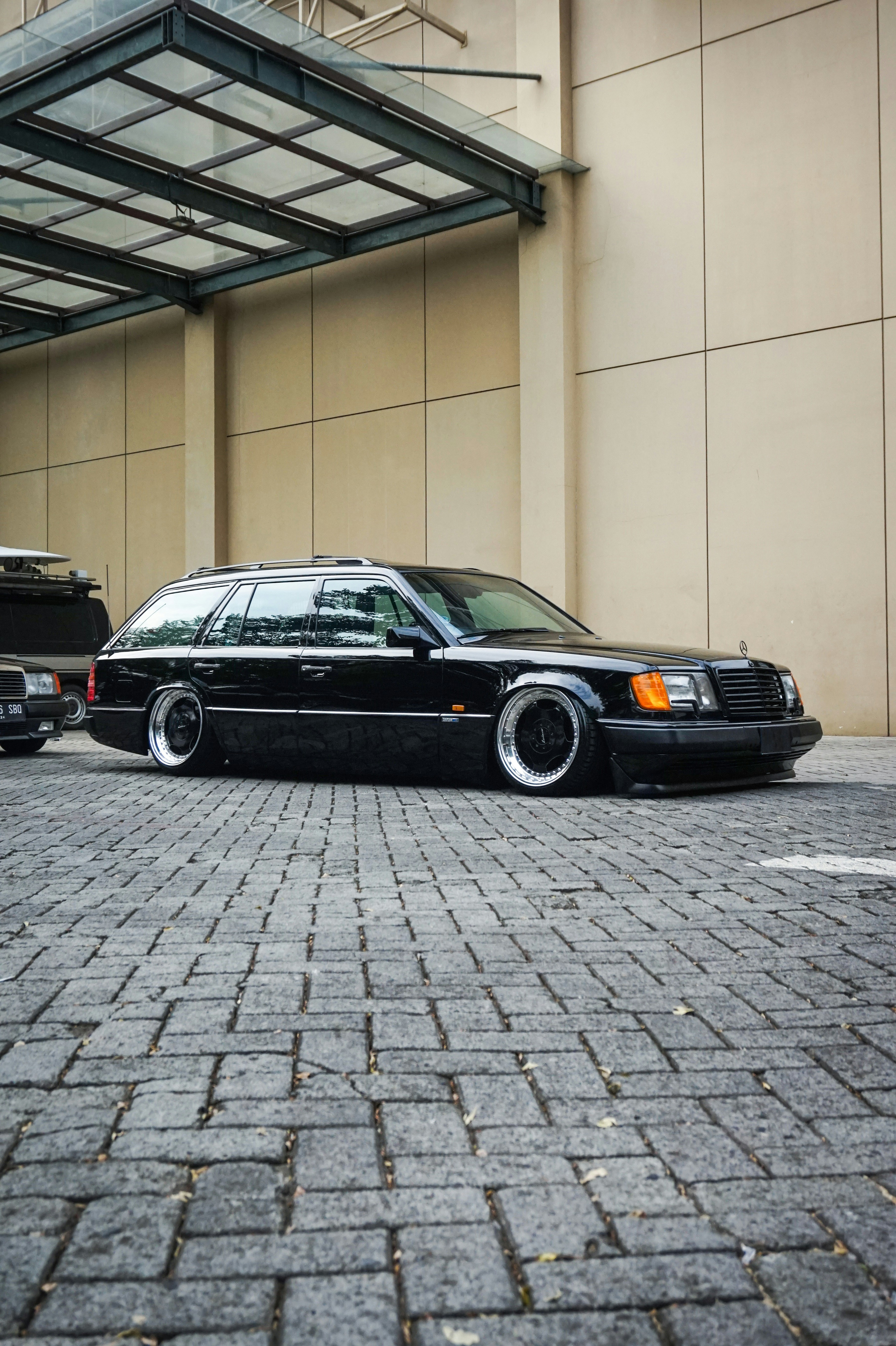 a black car parked in front of a building
