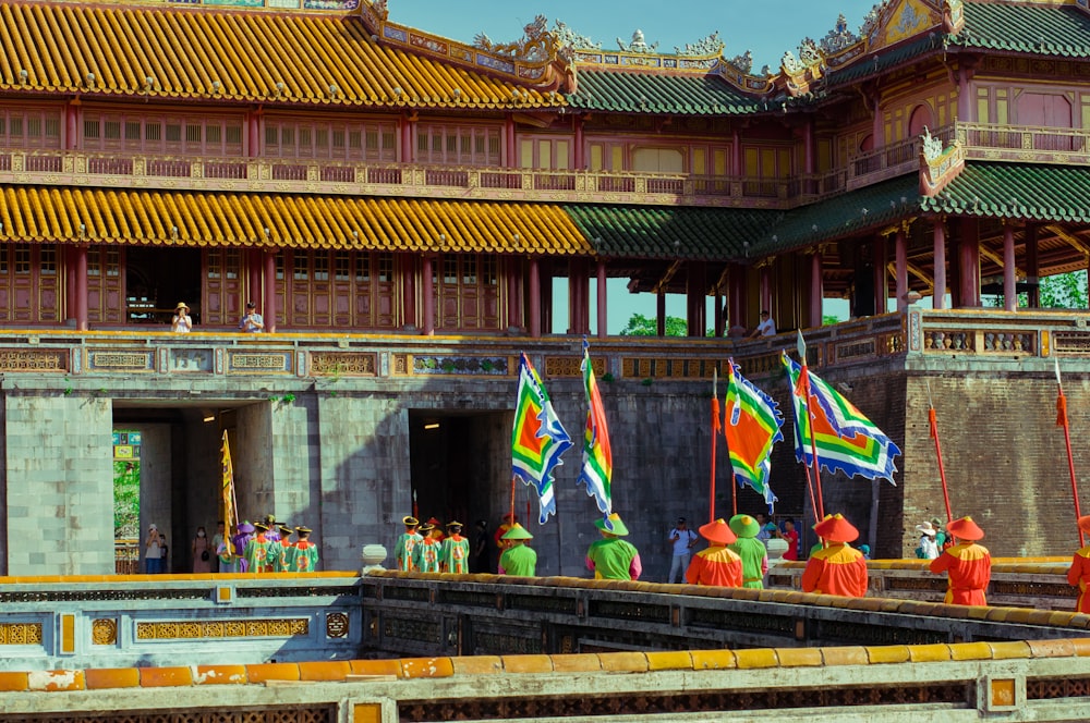 a group of people standing in front of a building