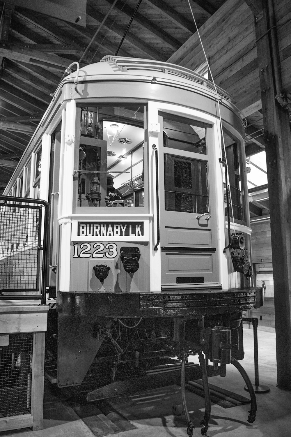 a black and white photo of a trolley car