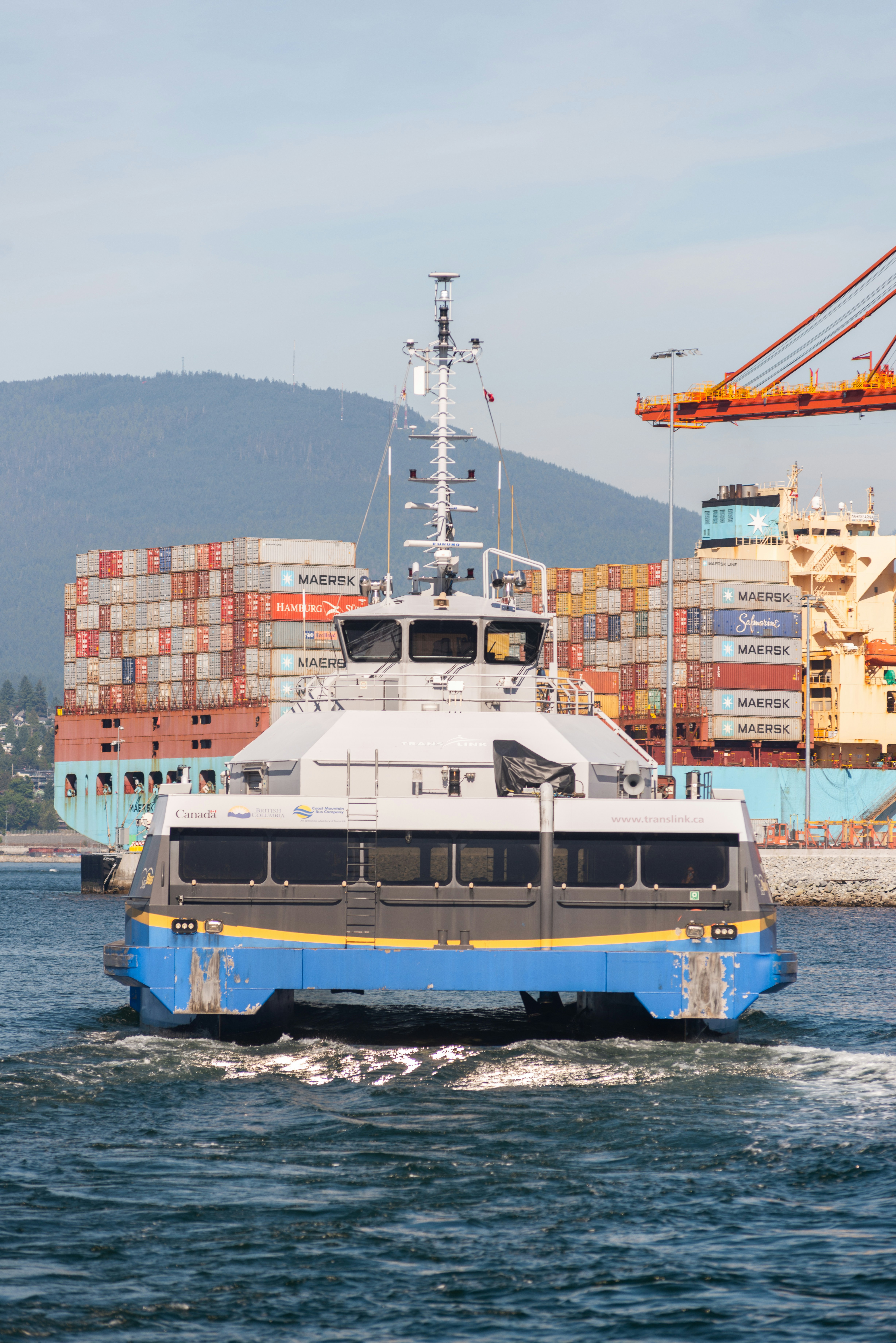a blue and white boat in a body of water