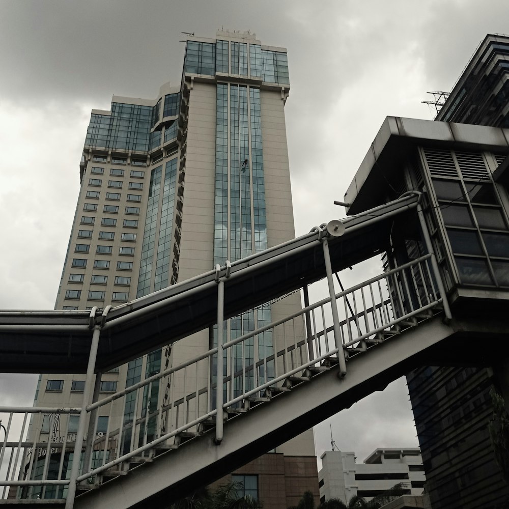 a bridge with a building in the background