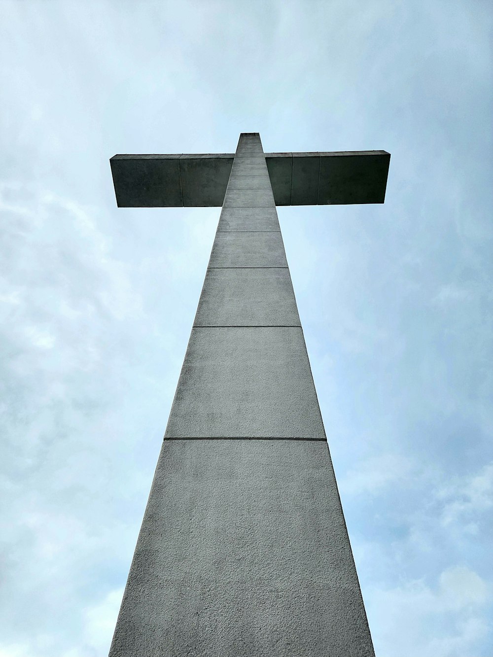 a tall monument with a cross on top of it