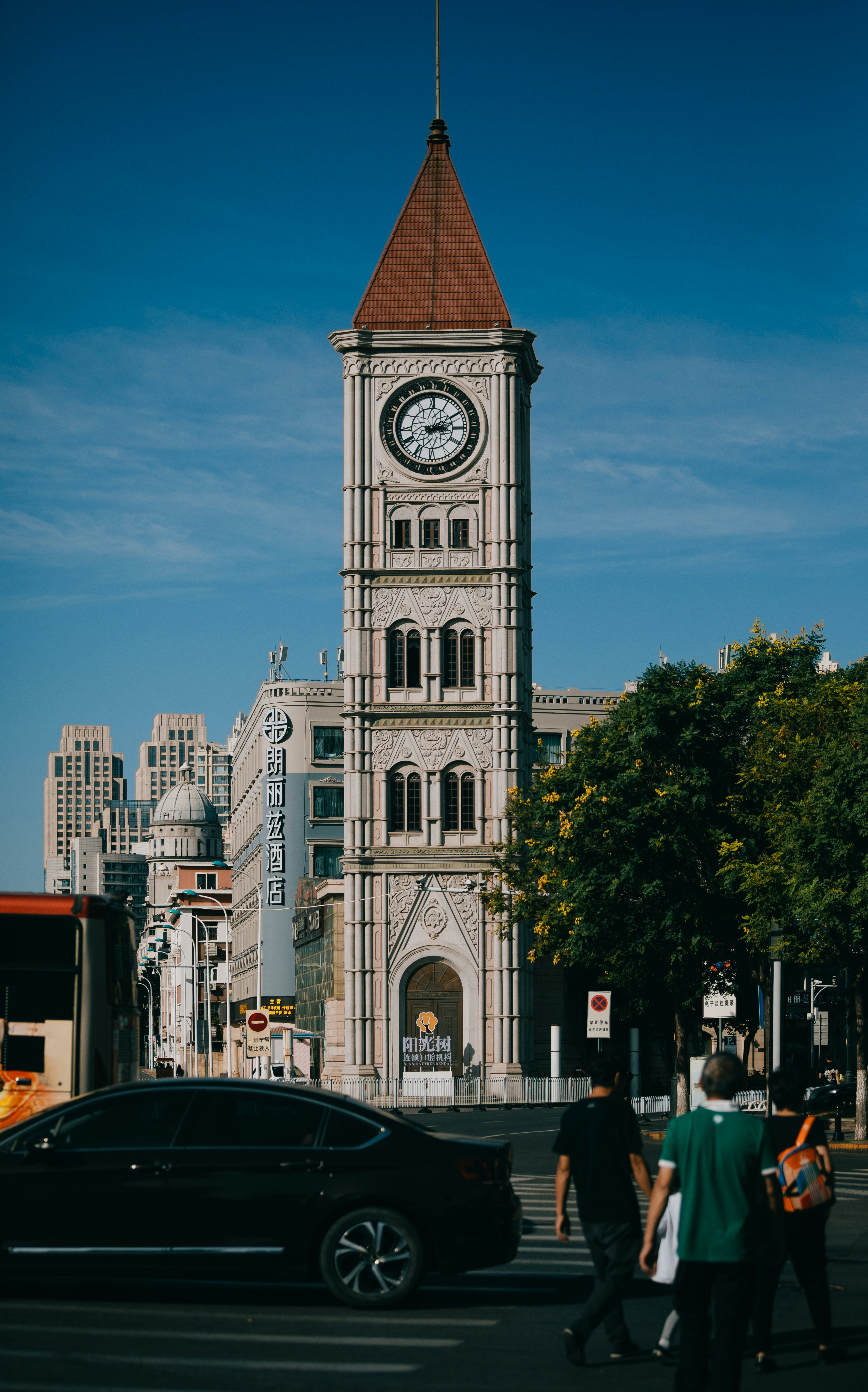 A tall clock tower towering over a city photo – Free Car Image on Unsplash
