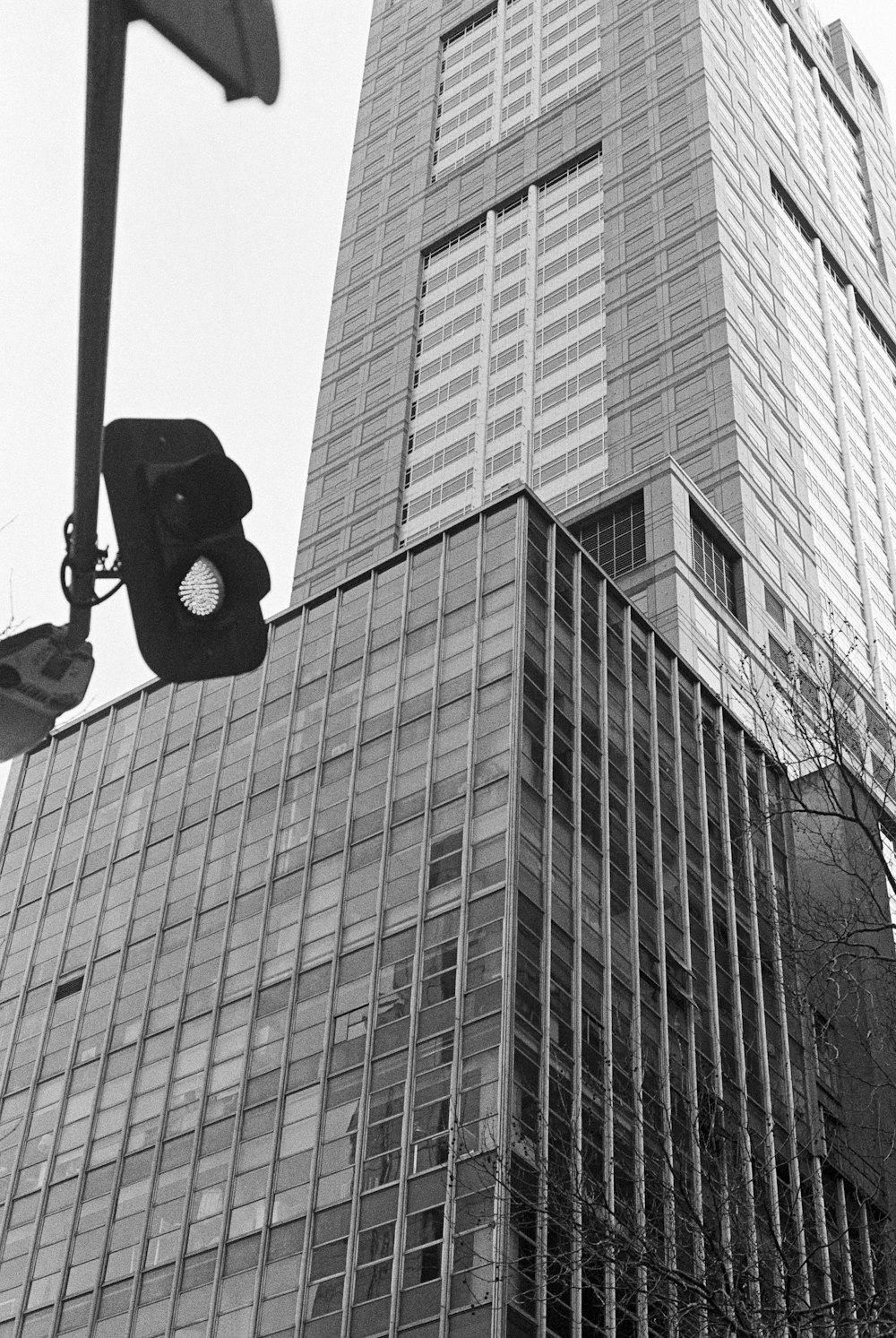 a traffic light in front of a tall building