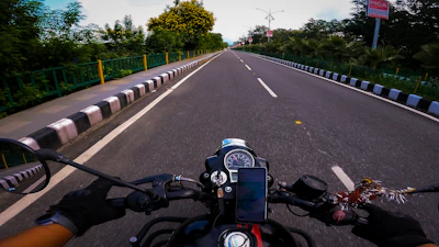 A confident driver behind the wheel with a clear road ahead symbolizing protection.