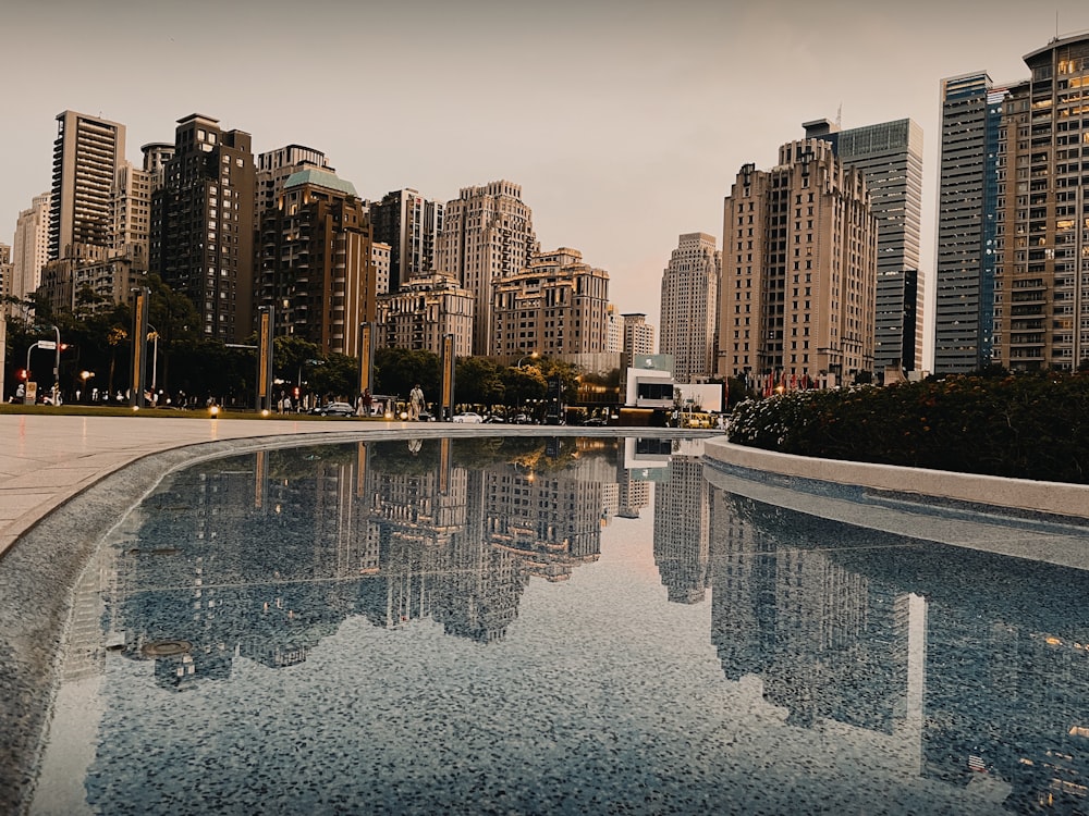 a view of a city from across a pool