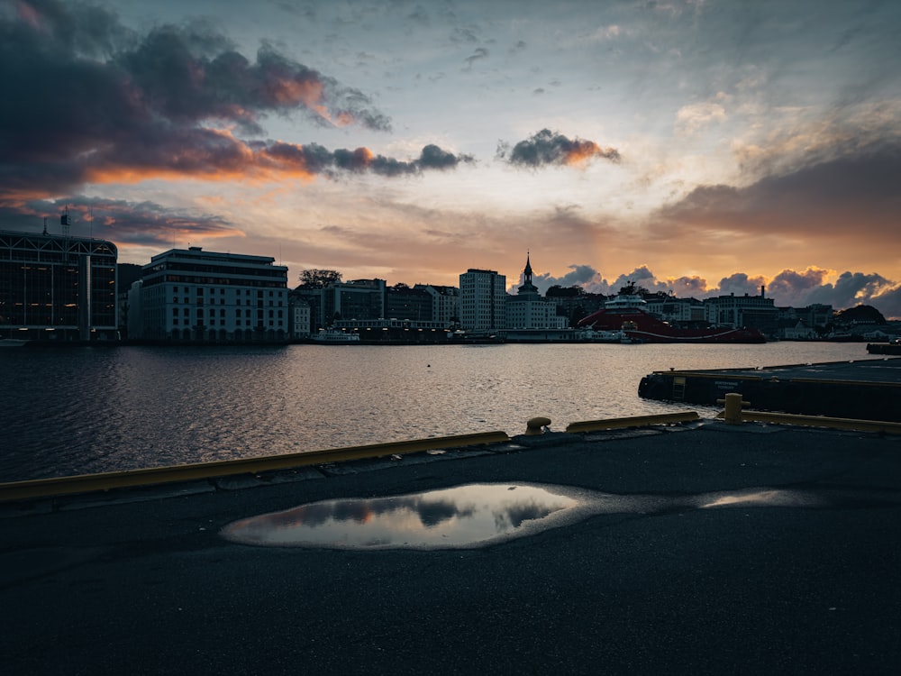 a body of water with a city in the background