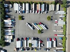 A fleet of company vehicles parked orderly, representing organized fleet management.