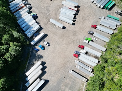Side view of a heavy-duty semi-trailer trailer parked on an industrial lot.