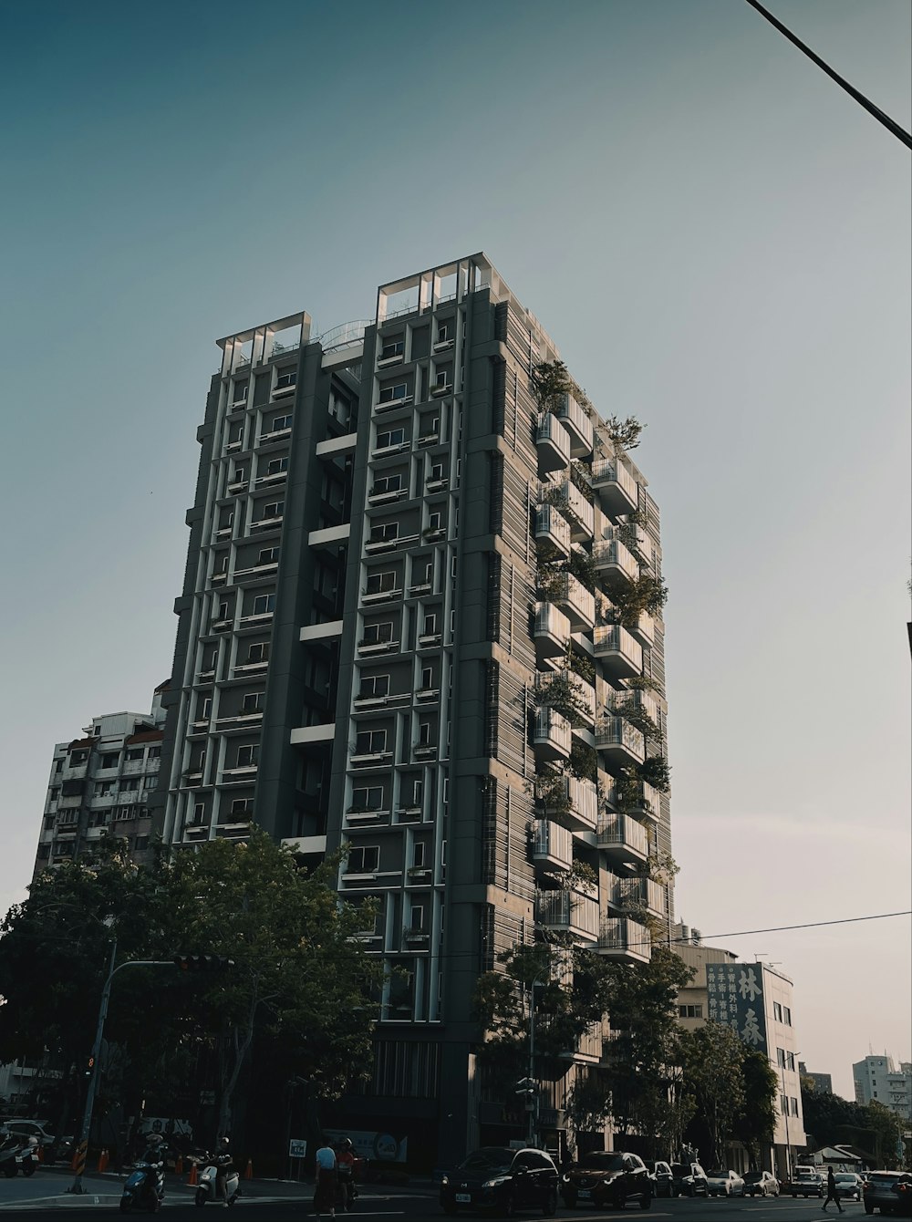 a tall building with lots of windows and balconies