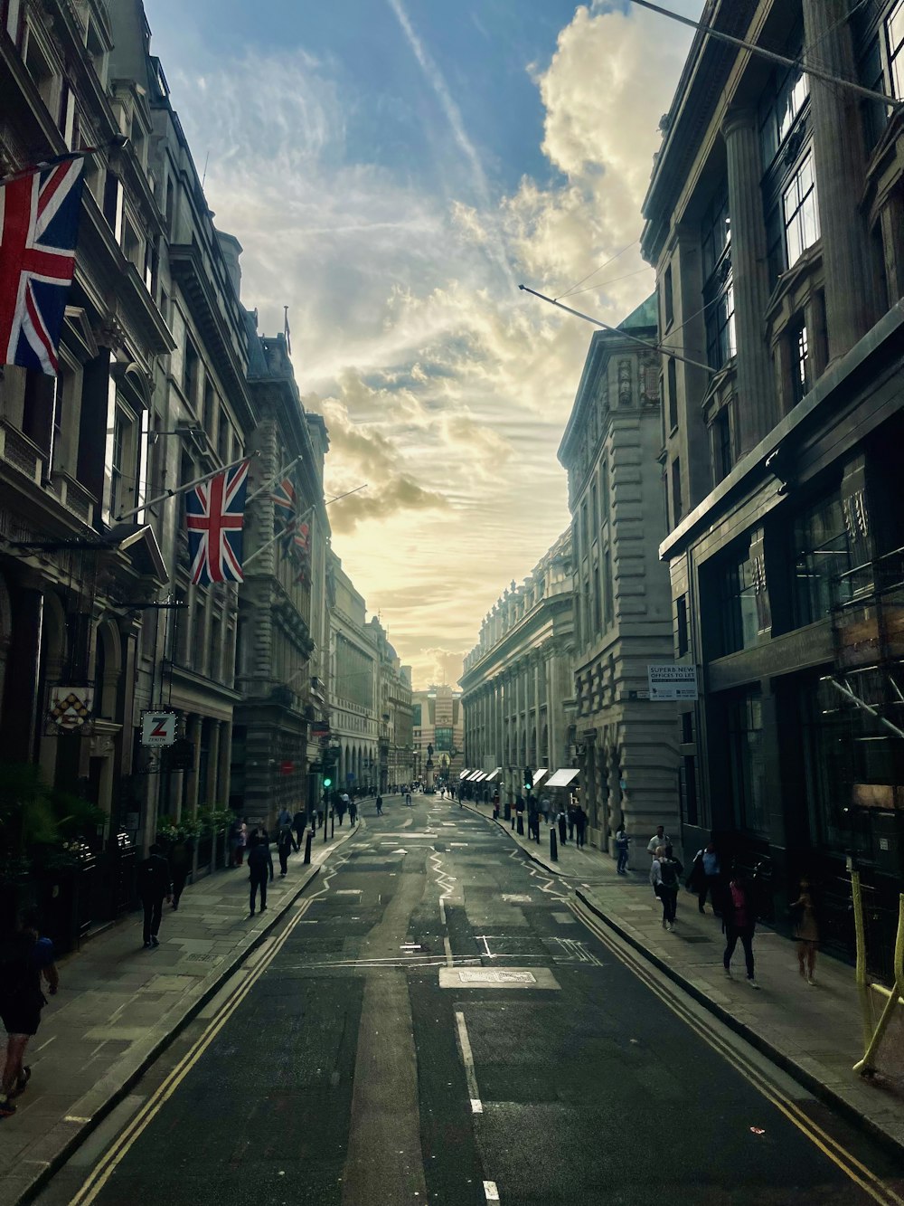 a city street with people walking on it