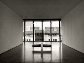 An empty room transformed with tasteful virtual furniture in muted tones.