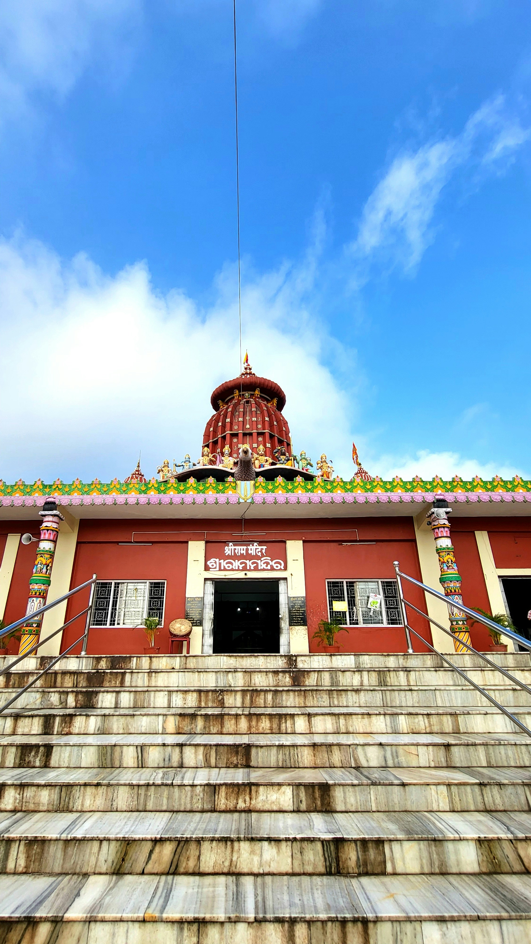 a red building with stairs leading up to it