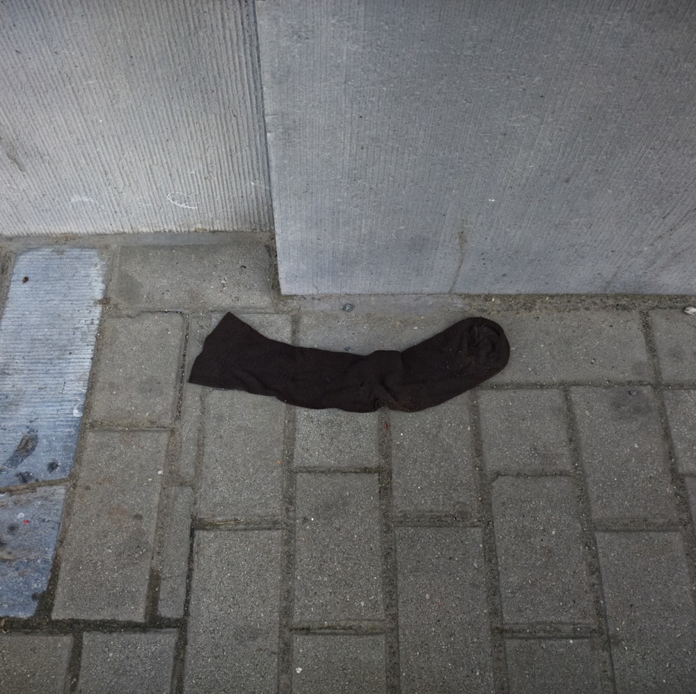 a pair of black socks laying on the ground