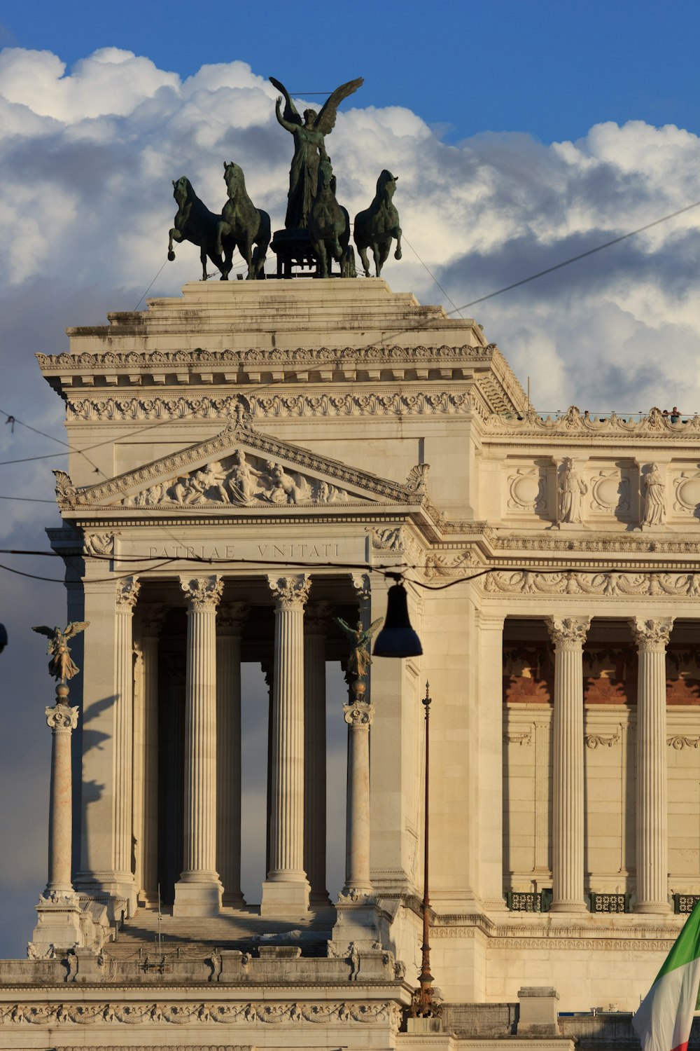 a statue of a man on a horse on top of a building