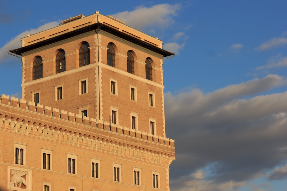 a tall building with a clock on the top of it