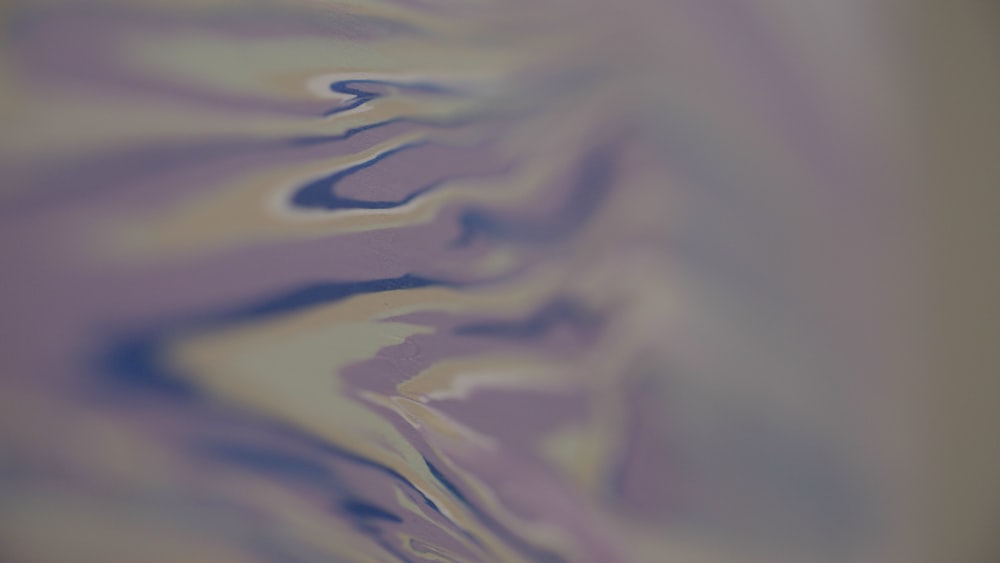 a blurry image of a purple and yellow background