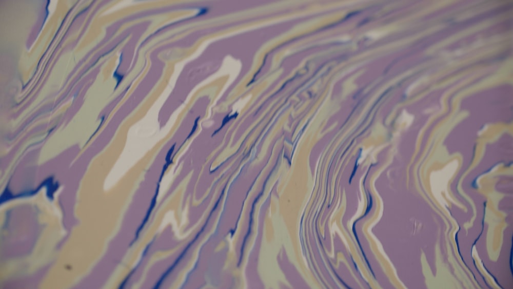 a close up of a purple and yellow liquid