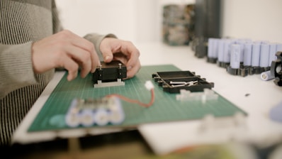 Technician assembling custom battery system in high-tech lab