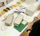 a woman working on a project at a table